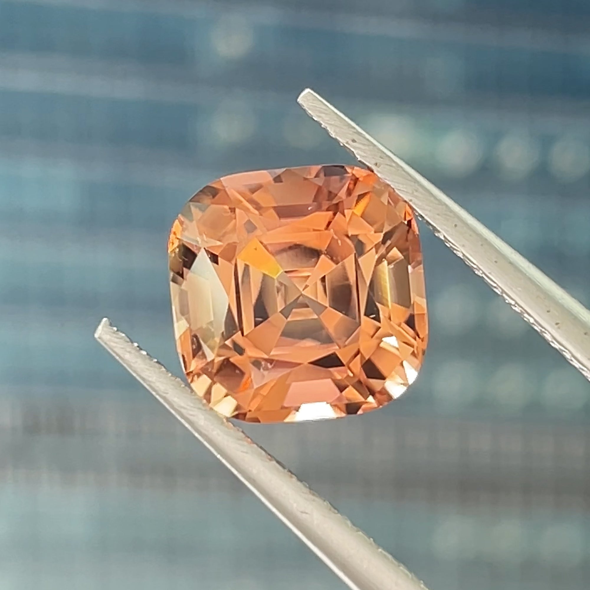 2.55 carat Peach Tourmaline from Congo, Precision cut in Square Cushion, Blue background