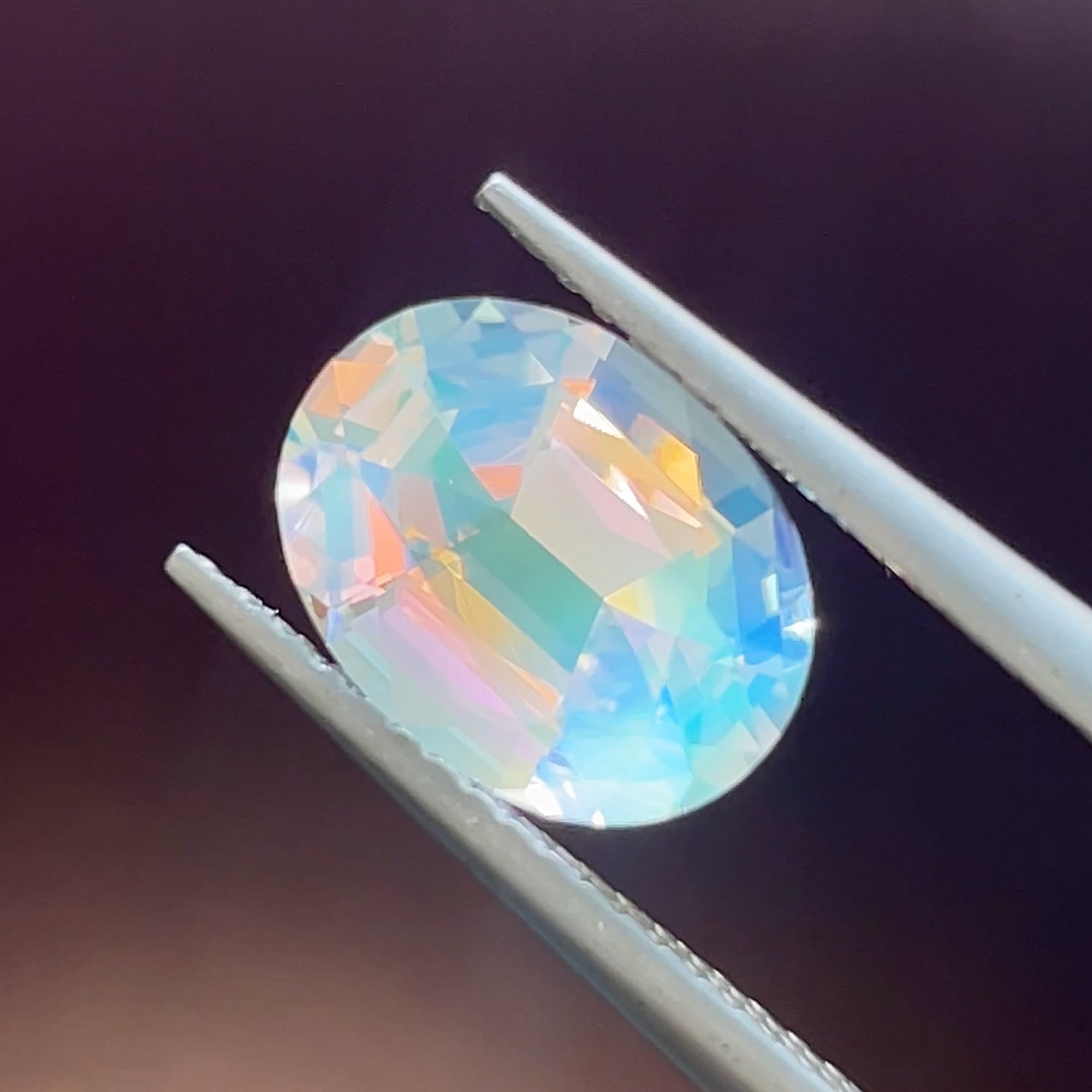 Precision Cut 2.21 ct Faceted Rainbow Moonstone, adularescence effect, face-up view horizontal