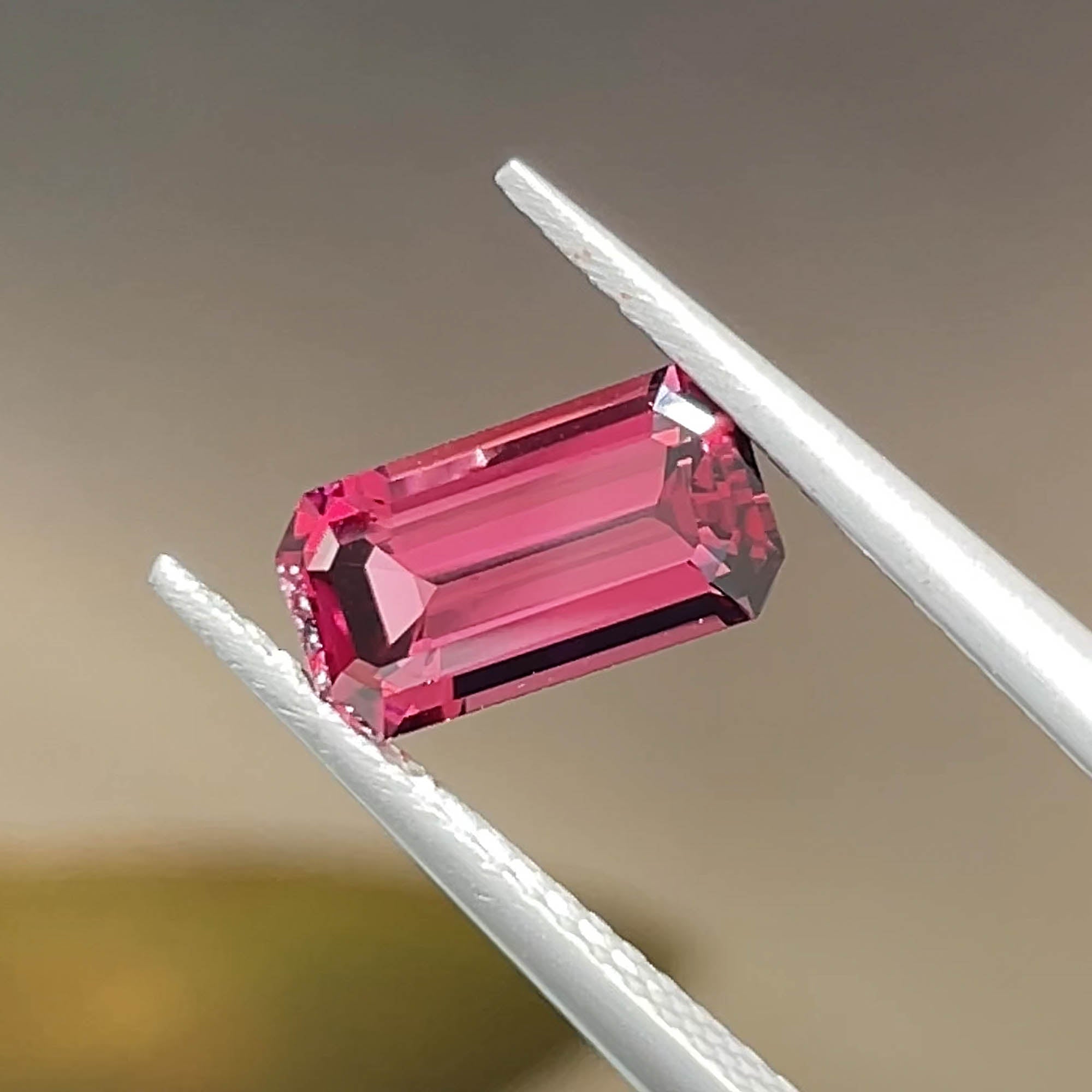 Precision cut 1.61 ct Umbalite Garnet from tanzania, emerald cut, face-up view 2