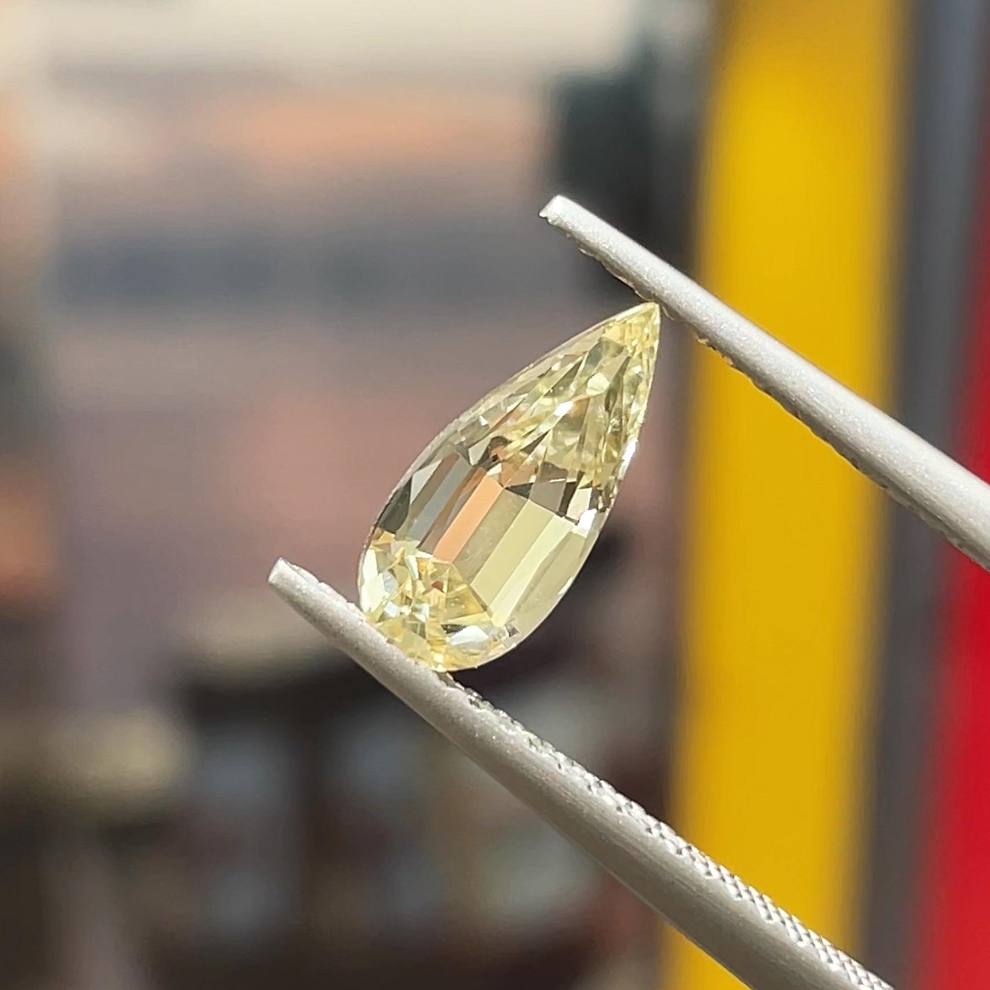 1.28 ct Precision Cut Yellow Chrysoberyl, Pear shape, tweezers view